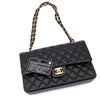 Chanel Classic Timeless Double Flap Bag in Medium Größe aus schwarzem Lammleder Material mit goldener Hardware