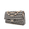 Gestreifte Chanel Classic Timeless Double Flap Bag in Medium Größe aus schwarz weißem Jersey Material mit goldener Hardware aus der limitierten Coco Sailor Kollektion Seitenansicht