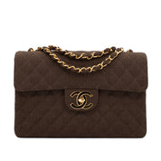 Vintage Chanel Classic Timeless Single Flap Bag in Jumbo Maxi Größe aus braunem Leinen Canvas Material mit goldener Hardware Vorderansicht